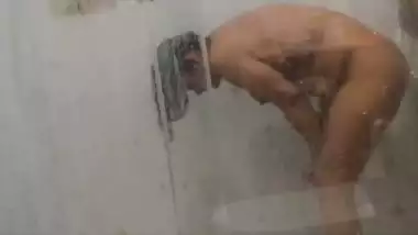 Desi girl under shower naked bath caught on camera