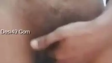 Big-tittied Desi gal strips and XXX pleases herself with fingering